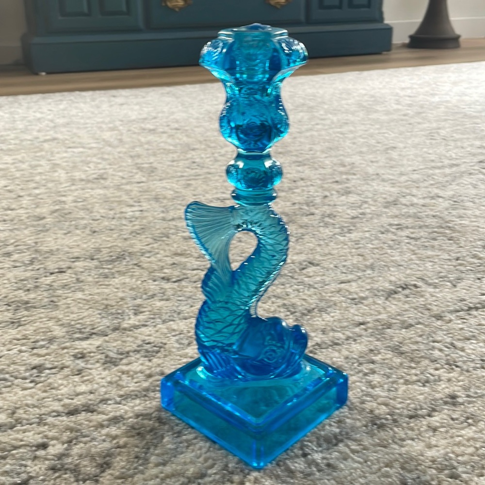 Pair of Museum of Modern Art Blue glass dolphin candlesticks.